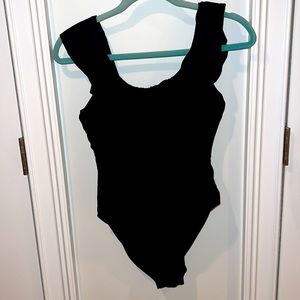 Black ruffle top bodysuit or swimsuit
